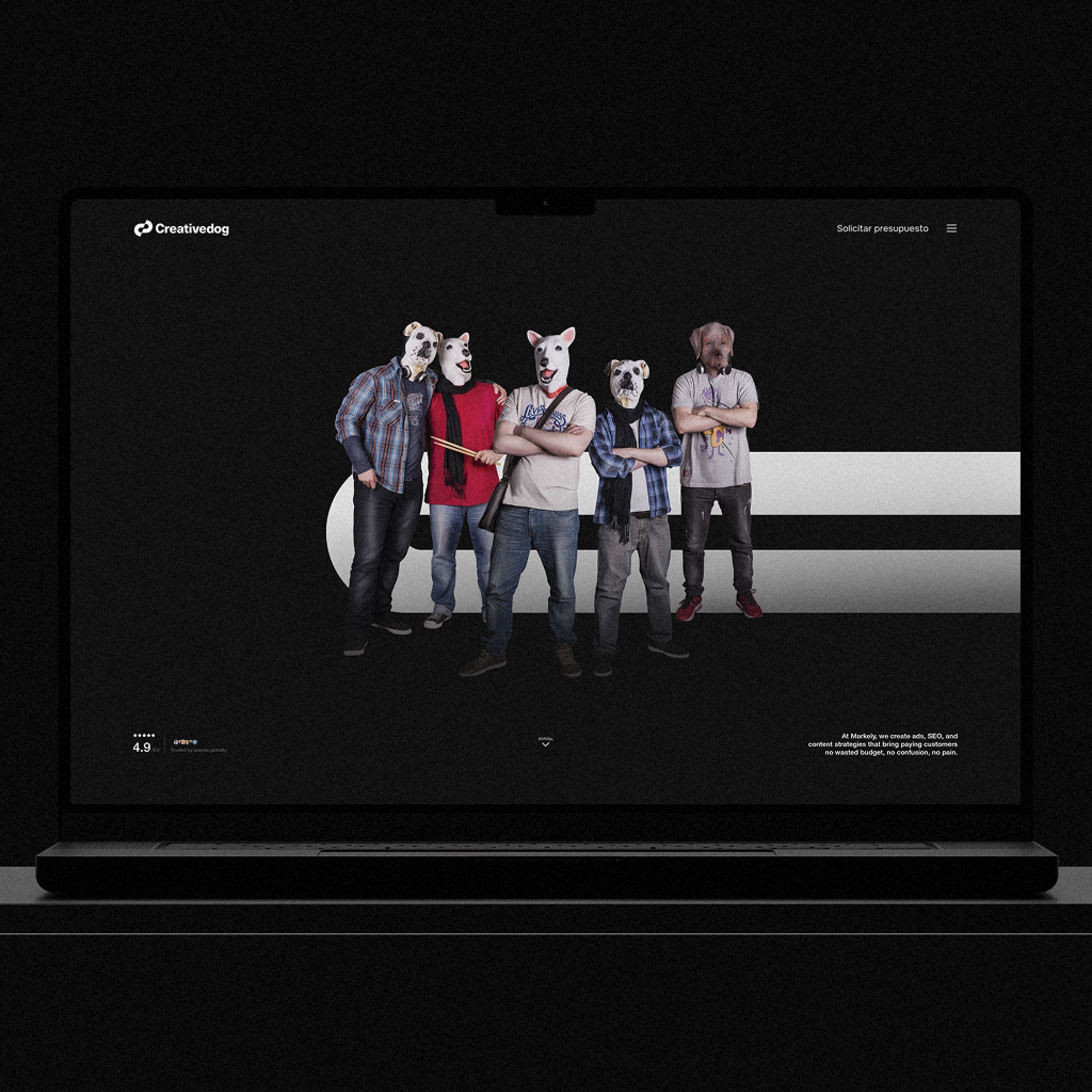 The website on a laptop: the team, all wearing dog masks