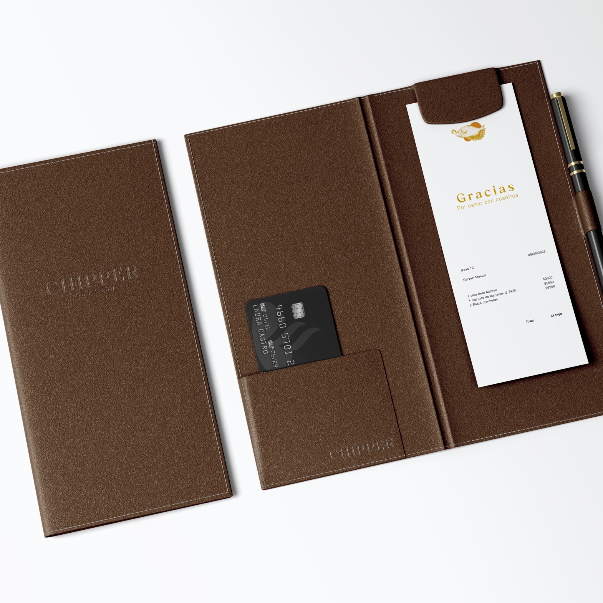 The brown leather check presenter, with the bill and a card