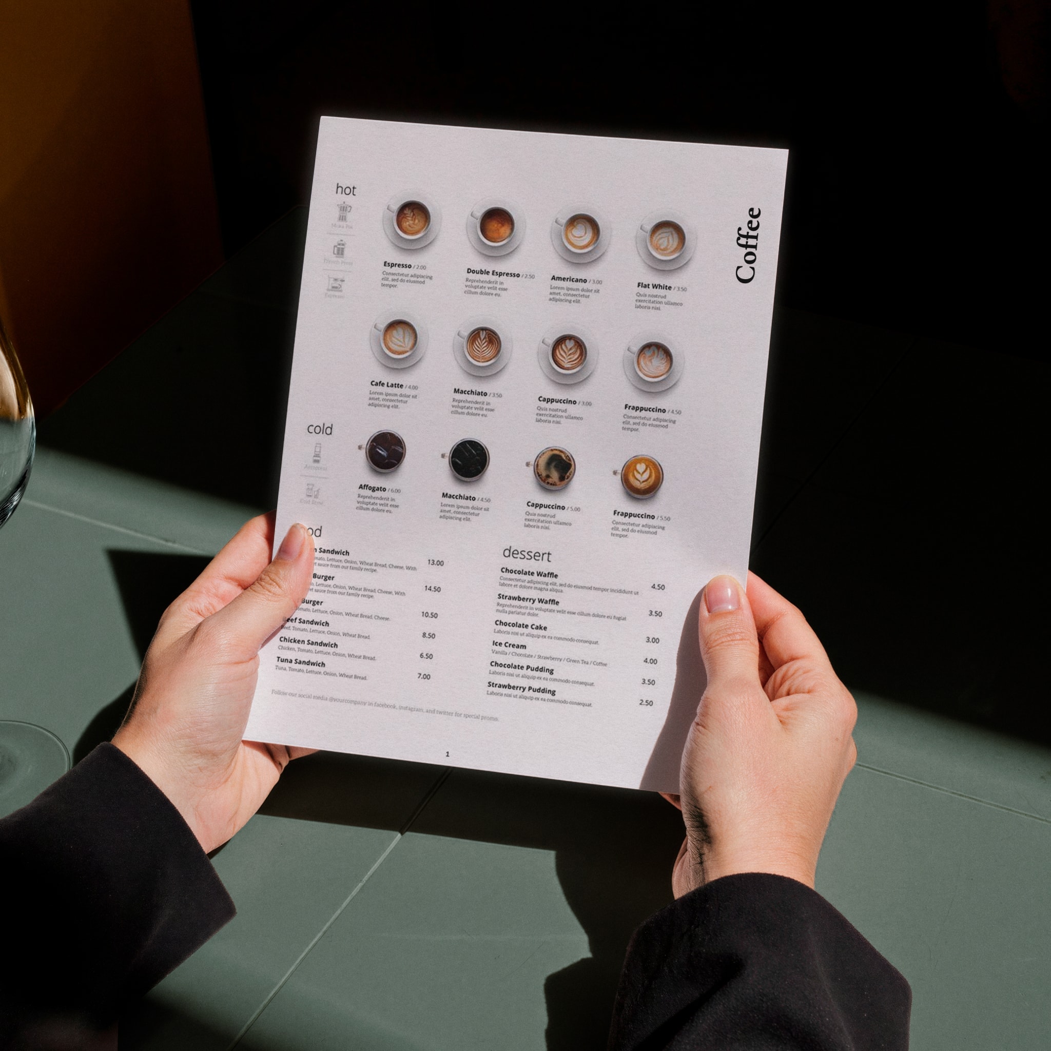 Hands holding the coffee menu
