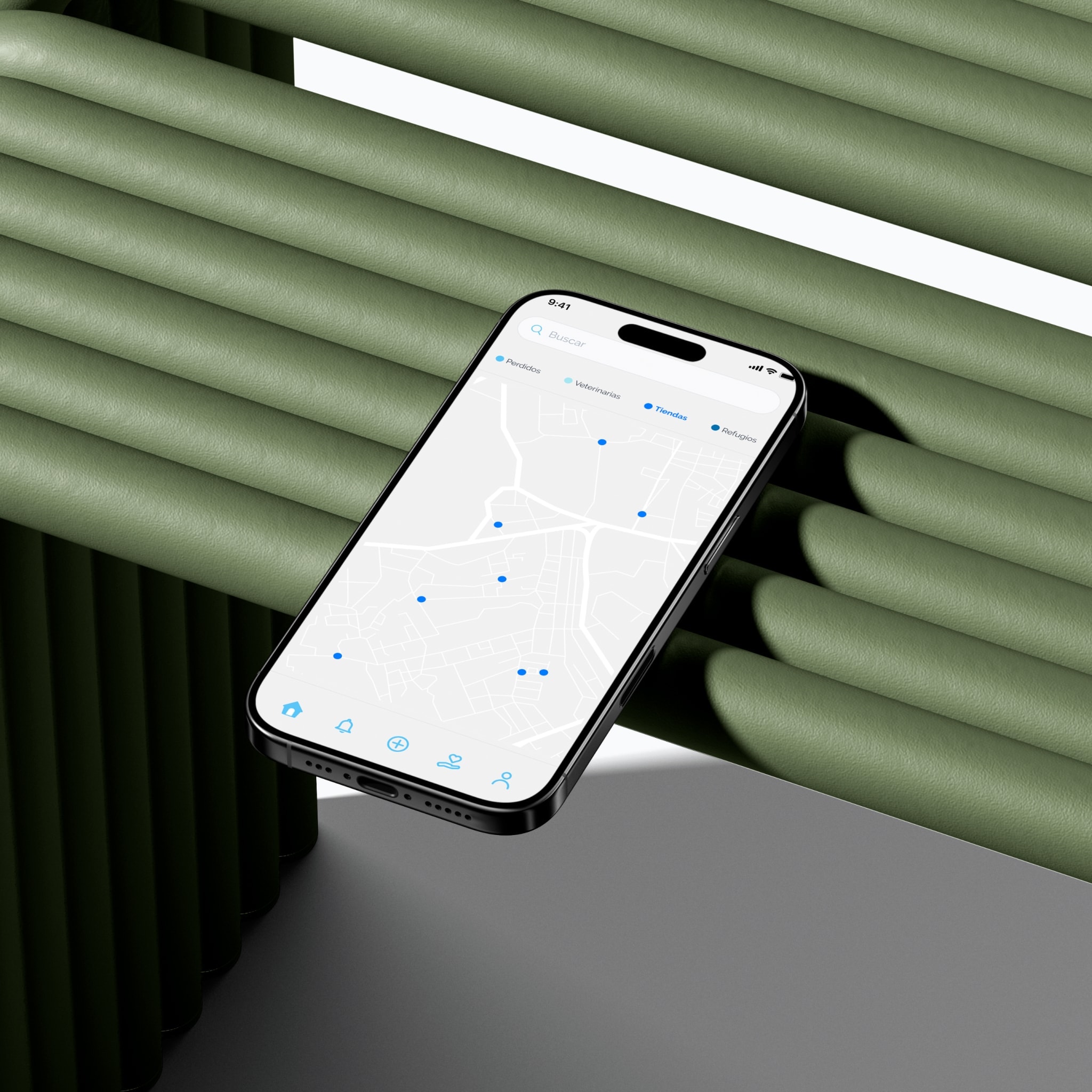 The Patitas map screen on a phone, over green ribbed panels
